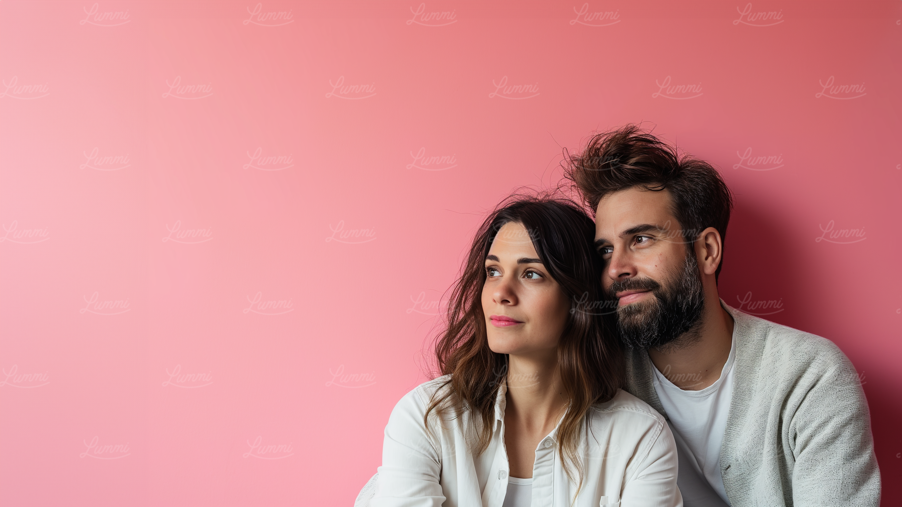Contemplative Couple Against Pink